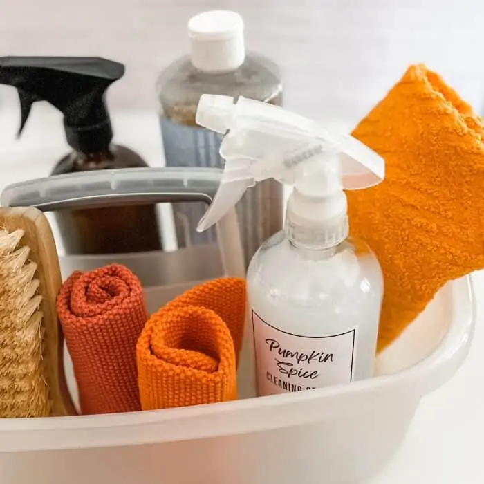 cleaning tote with pumpkin spice cleaner, Castile soap, natural scrub brush, and microfiber cloths