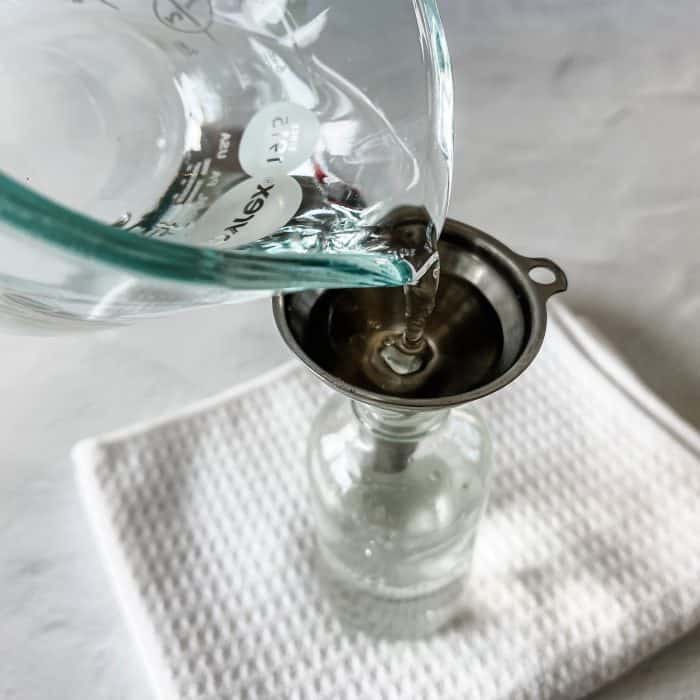 adding water to spray bottle