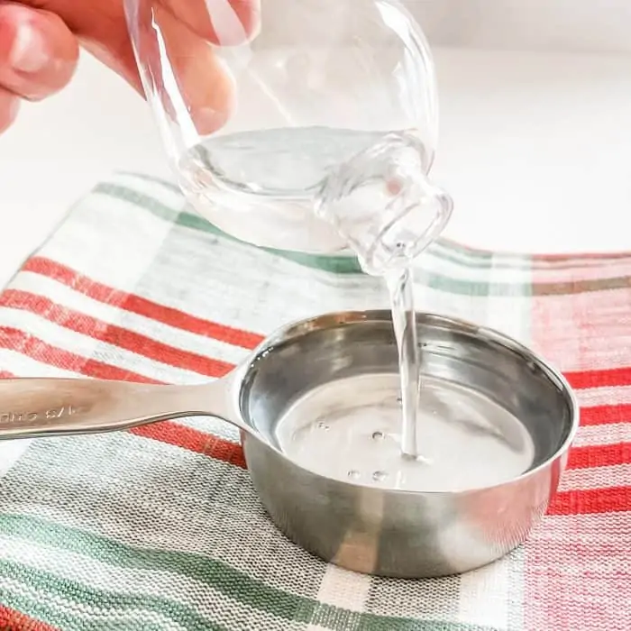 fill ornament with water and then pour water into measuring cup to see how much bath oil you'll need