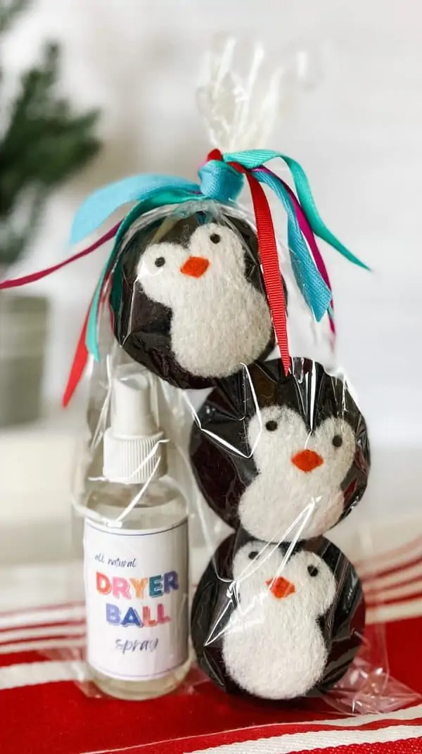 woold dryer balls are stacked inside cello gift bag along with all natural dryer ball spray
