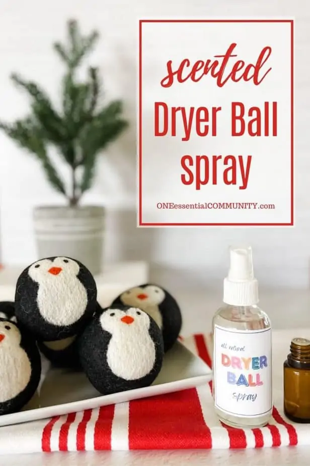 penguin dryer balls in tray in front of evergreen plant -- net to dryer ball spray bottle and essential oil bottles -- "scented dryer ball spray" by oneessentialcommunity.com