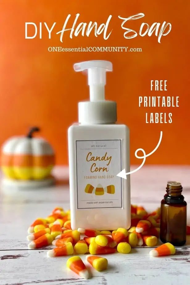 DIY Hand soap with free printable labels by oneessentialcommunity.com -- candy corn scented hand soap with essential oil bottle, candy corn, and candy-corn-striped pumpkin