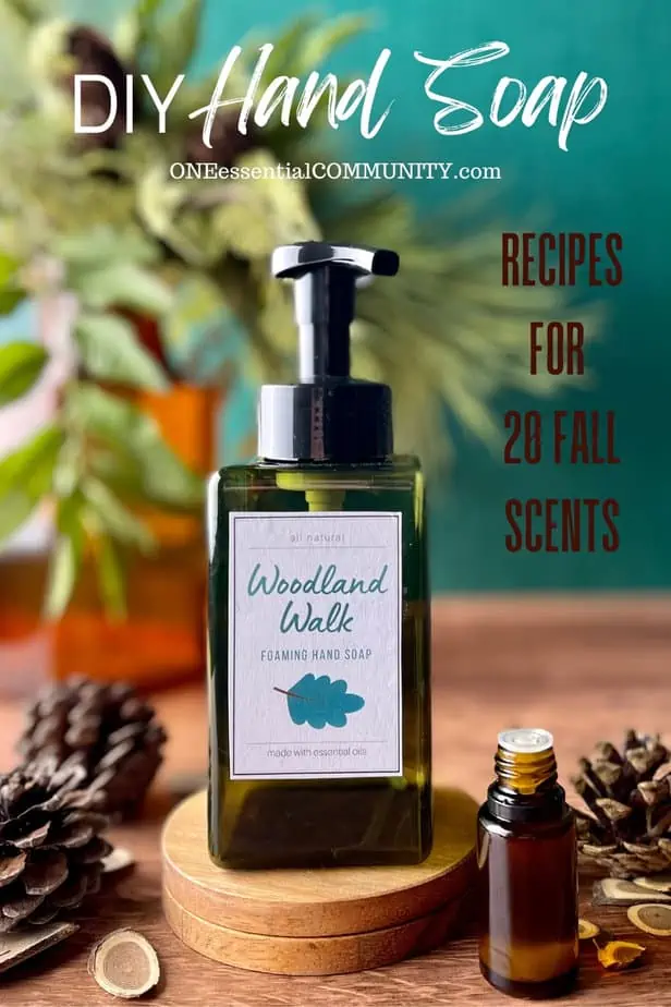 DIY hand soap with recipes for 20 fall scents by oneessentialcommunity.com -- woodland walk scented hand soap with pinecones, essential oil bottle, and small wood slices