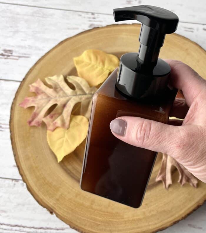 putting on pump top and shaking soap mixture well