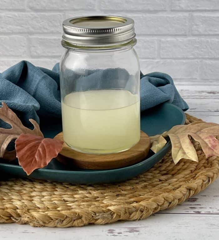 homemade reed diffuser mixture once shaken in mason jar (mixture is now uniform solution)