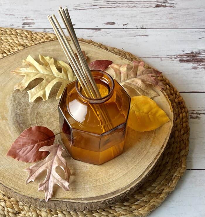 placing 5-8 reed diffuser sticks in vase with narrow opening